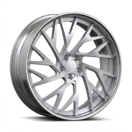 High-end 3/4 perspective of a brushed aluminum custom wheel for Chevy Impala, highlighting the modern geometric spokes and clean, logo-free center cap on a pure white background.